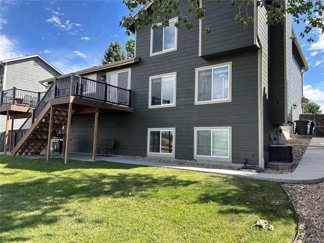 1495 Goldsmith Dr, Highlands Ranch, CO 80126 - rear view of property with a patio area, a wooden deck, stairs, and a lawn