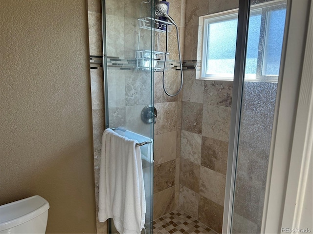 1495 Goldsmith Dr, Highlands Ranch, CO 80126 - full bathroom with a shower stall and a textured wall