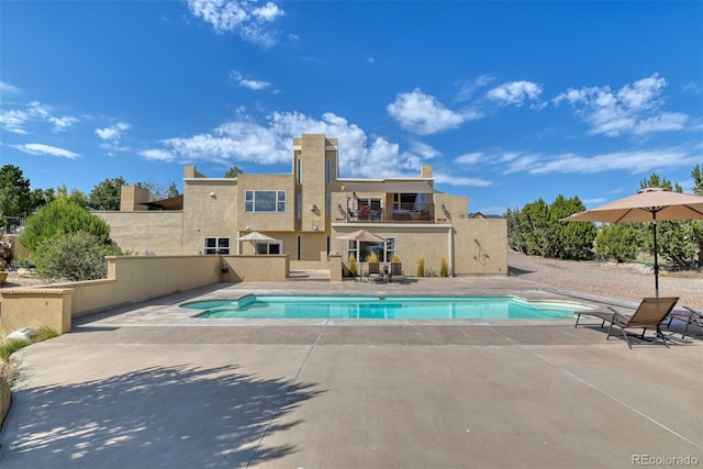 view of swimming pool featuring a patio area