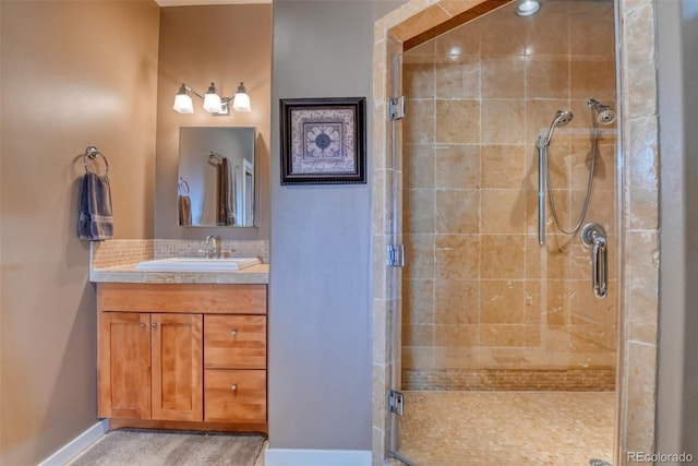 bathroom featuring vanity and an enclosed shower