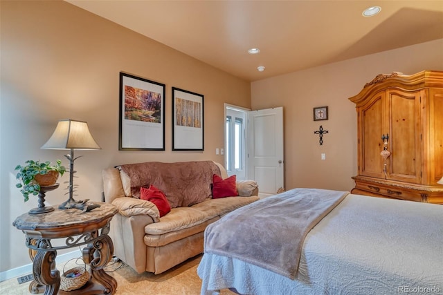 bedroom with light colored carpet