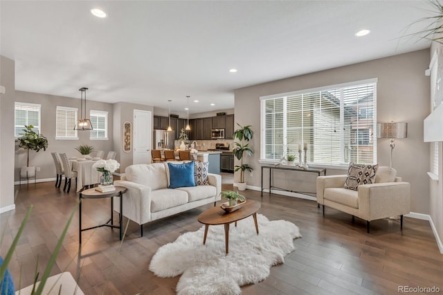 540 E Fremont Pl, Centennial, CO 80122 - living area with baseboards, recessed lighting, healthy amount of natural light, and wood finished floors