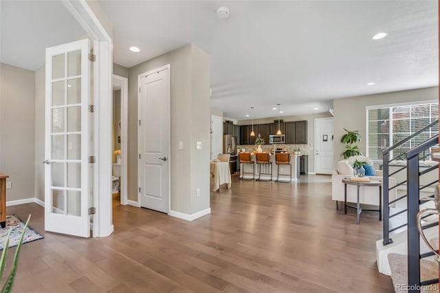 540 E Fremont Pl, Centennial, CO 80122 - entrance foyer with wood finished floors, baseboards, stairway, and recessed lighting