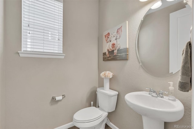 540 E Fremont Pl, Centennial, CO 80122 - bathroom with toilet, baseboards, and a sink