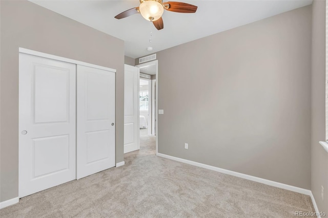 540 E Fremont Pl, Centennial, CO 80122 - unfurnished bedroom with light carpet, baseboards, a closet, and a ceiling fan