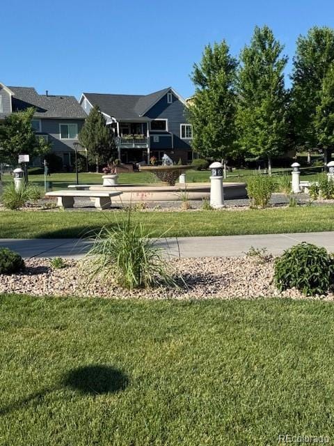 14247 W 84th Cir Unit A, Arvada, CO 80005 - view of home's community with a lawn