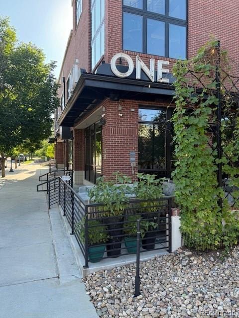 14247 W 84th Cir Unit A, Arvada, CO 80005 - property entrance with brick siding