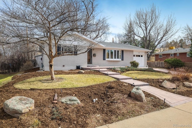 ranch-style house featuring a front lawn, an attached garage, fence, and brick siding