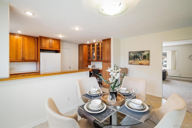 dining area with light tile patterned floors, recessed lighting, baseboards, and a baseboard radiator