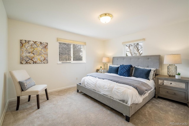 bedroom with carpet flooring and baseboards