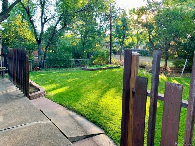 view of yard featuring fence private yard and a gate