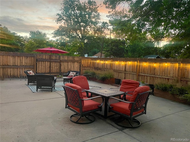 4057 Bryant St, Denver, CO 80211 - fenced backyard featuring a patio, outdoor dining area, and outdoor lounge area