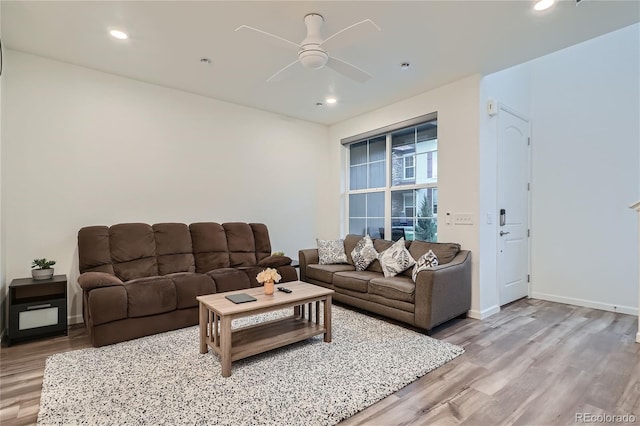 living room featuring wood finished floors, ceiling fan, recessed lighting, and baseboards