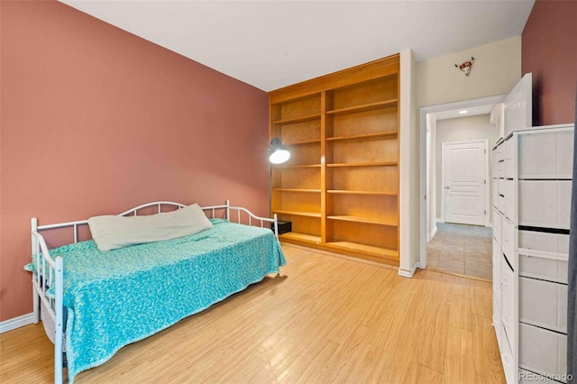 10170 E 151st Ct, Brighton, CO 80602 - bedroom with light wood-style flooring and baseboards