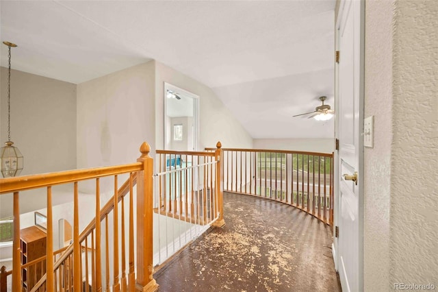 10170 E 151st Ct, Brighton, CO 80602 - hallway featuring lofted ceiling, carpet floors, an upstairs landing, and a textured wall