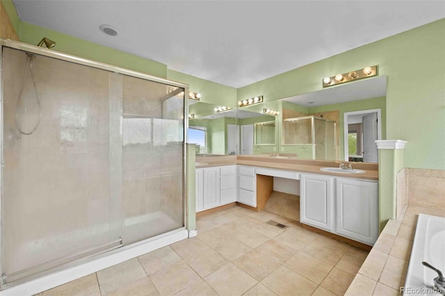 10170 E 151st Ct, Brighton, CO 80602 - bathroom with double vanity, a shower stall, a bath, and tile patterned flooring
