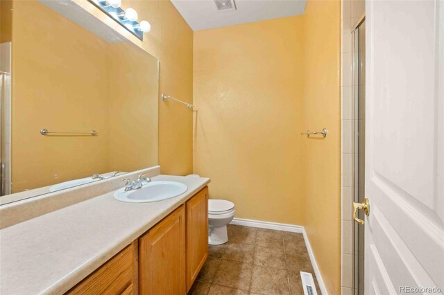 10170 E 151st Ct, Brighton, CO 80602 - full bathroom featuring vanity, toilet, baseboards, tile patterned flooring, and a shower