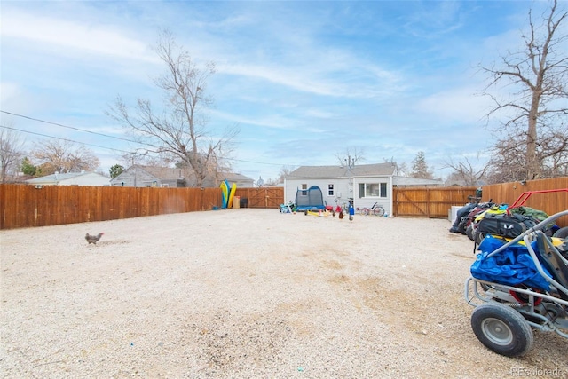 view of yard featuring an outbuilding and a fenced backyard