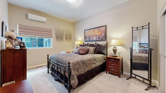 bedroom with light colored carpet, an AC wall unit, visible vents, and baseboards