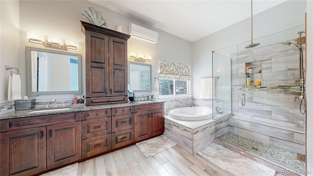 full bath featuring a wall unit AC, a sink, a bath, and a shower stall