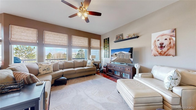 living room featuring ceiling fan and wood finished floors