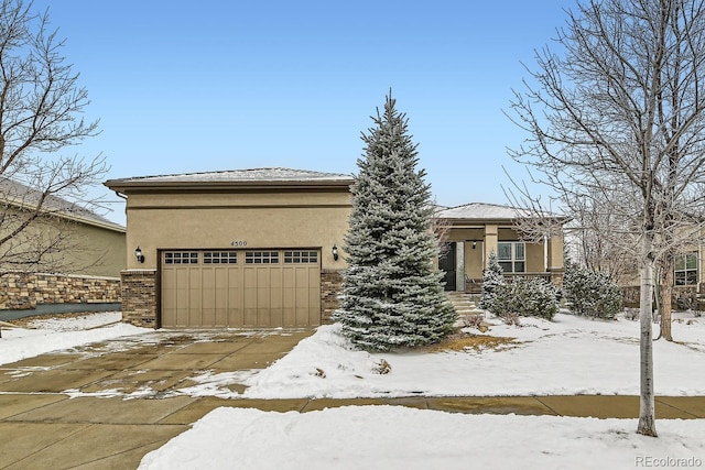 prairie-style home featuring a garage