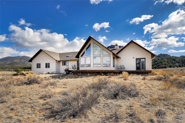 back of house featuring a mountain view