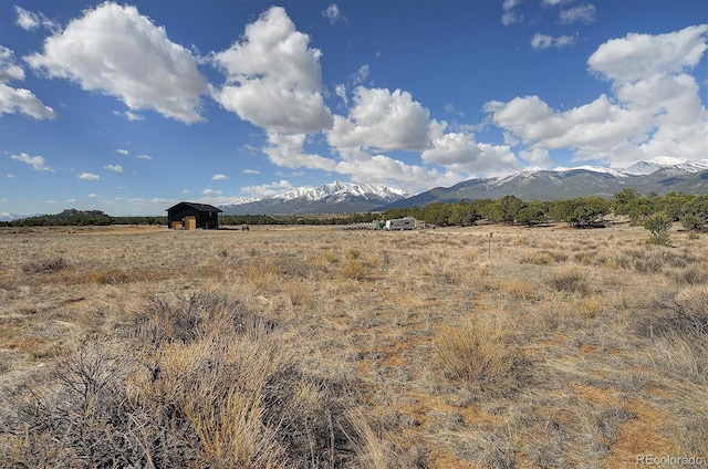 mountain view featuring a rural view