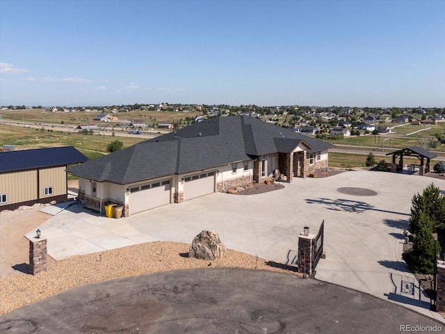 14025 Florence Ct, Brighton, CO 80602 - view of front of property with stone siding, concrete driveway, and a garage