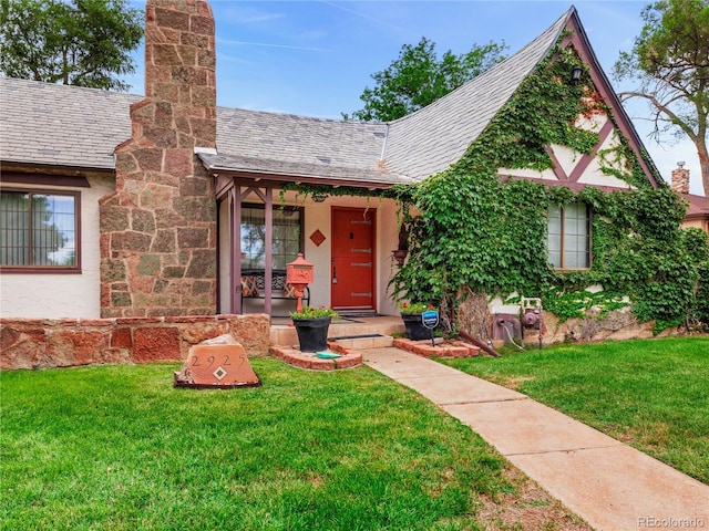 tudor house with a front lawn