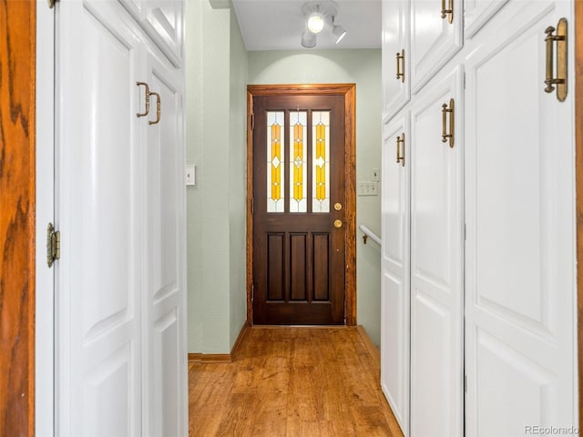 doorway with light hardwood / wood-style floors