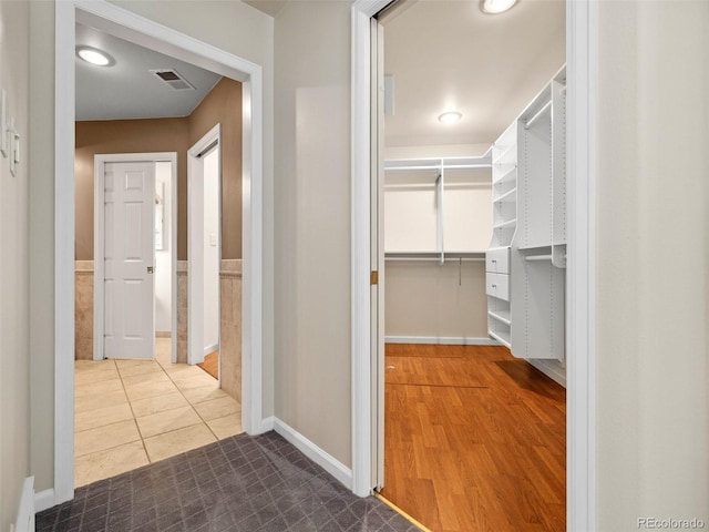 hallway featuring tile patterned floors