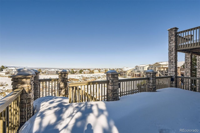 view of snow covered deck