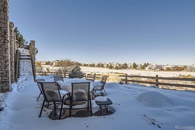 view of yard layered in snow