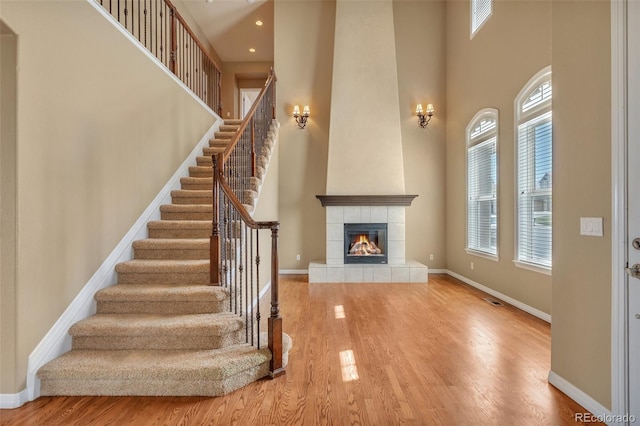 interior space with baseboards and a towering ceiling