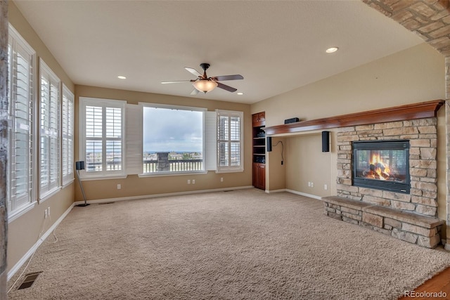 unfurnished living room with visible vents, baseboards, and plenty of natural light