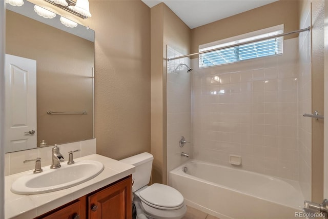 bathroom featuring shower / bath combination, toilet, and vanity