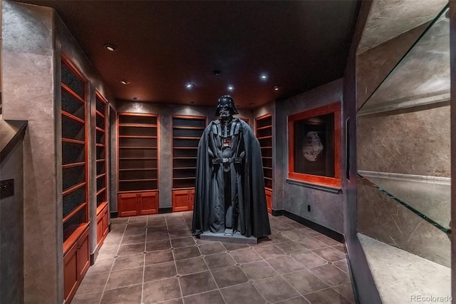 wine cellar featuring dark tile patterned flooring and recessed lighting