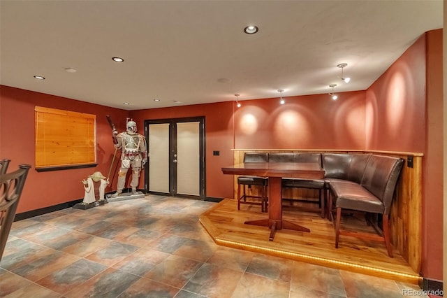 bar featuring baseboards and recessed lighting