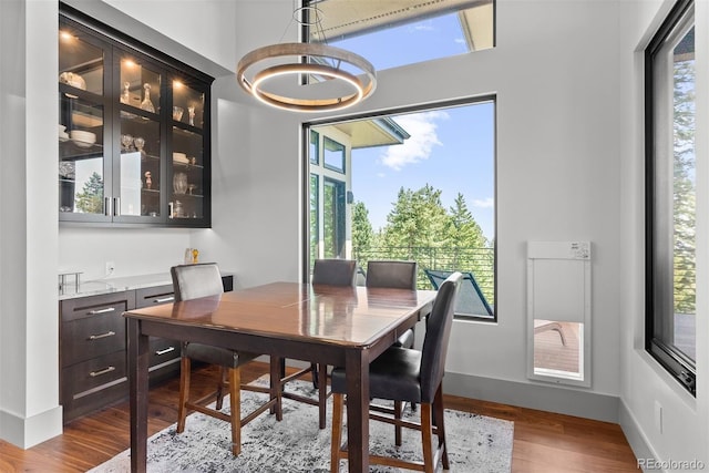 dining area with hardwood / wood-style flooring and plenty of natural light