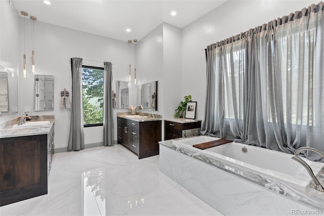 bathroom featuring a bathing tub and vanity