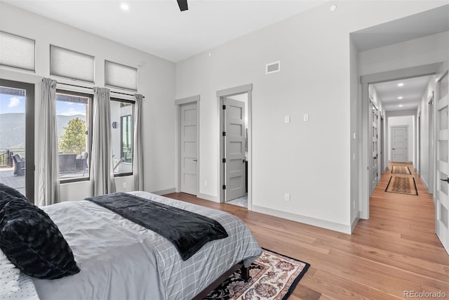 bedroom with ceiling fan and light wood-type flooring