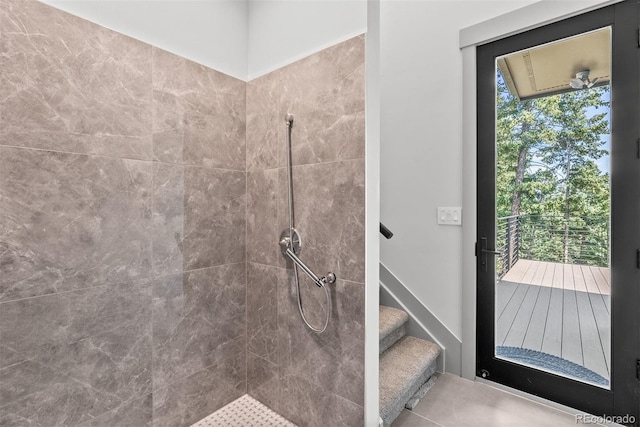 bathroom with a tile shower