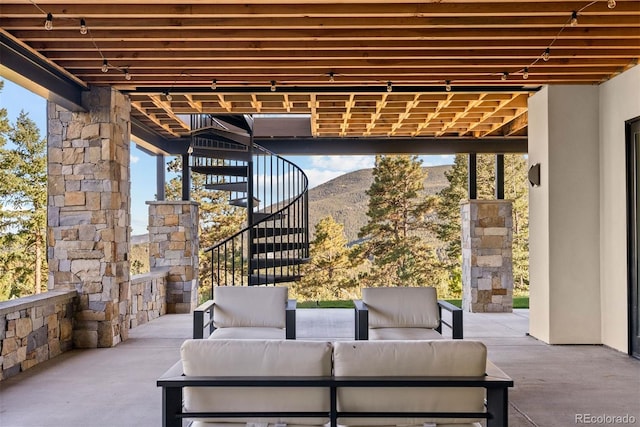 view of patio featuring a mountain view and an outdoor hangout area