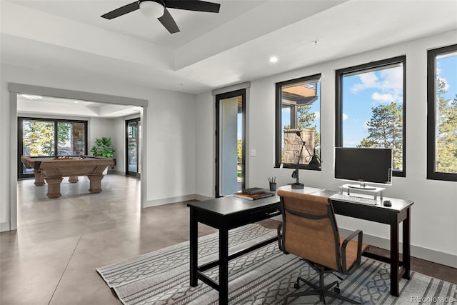 office space featuring ceiling fan, billiards, and concrete flooring