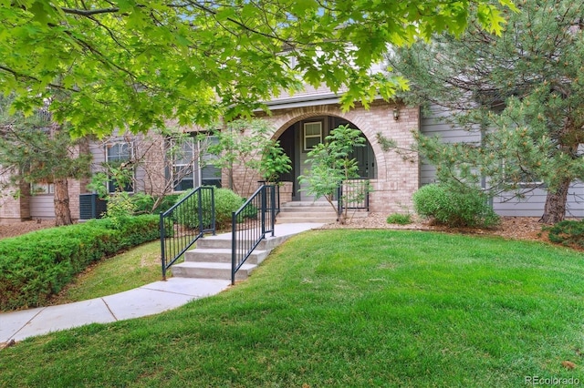 22932 E Ontario Dr Unit 102, Aurora, CO 80016 - obstructed view of property featuring a front yard