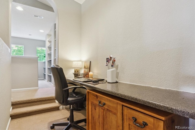 22932 E Ontario Dr Unit 102, Aurora, CO 80016 - carpeted office space with arched walkways and a textured wall