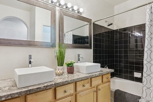 22932 E Ontario Dr Unit 102, Aurora, CO 80016 - bathroom featuring shower / bath combination with curtain and double vanity