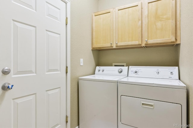 22932 E Ontario Dr Unit 102, Aurora, CO 80016 - laundry area with washer and dryer and cabinet space