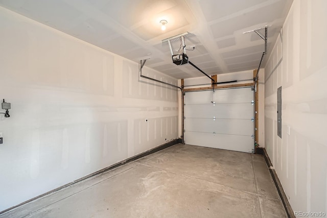 garage with electric panel and a garage door opener